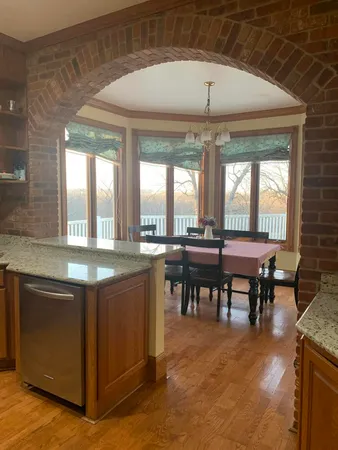 an open kitchen with a table and chairs