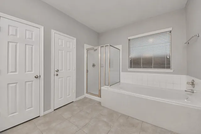 a white bath tub sitting next to a window