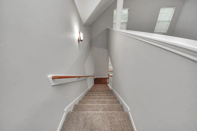 a view of a hallway with staircase
