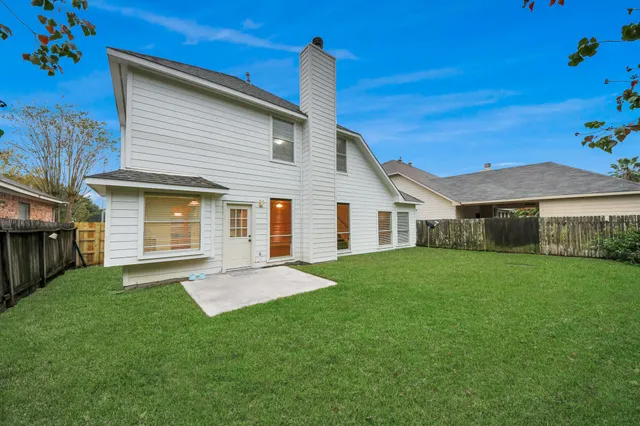 an aerial view of a house with a garden