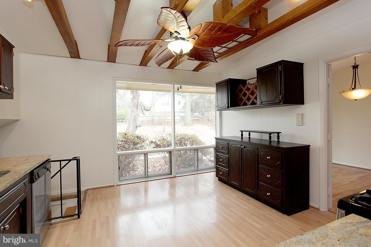 12917 Layhill Road Silver Spring, MD 20906 - Photo 12 of 30 a living room with hard wood floors and a flat screen tv