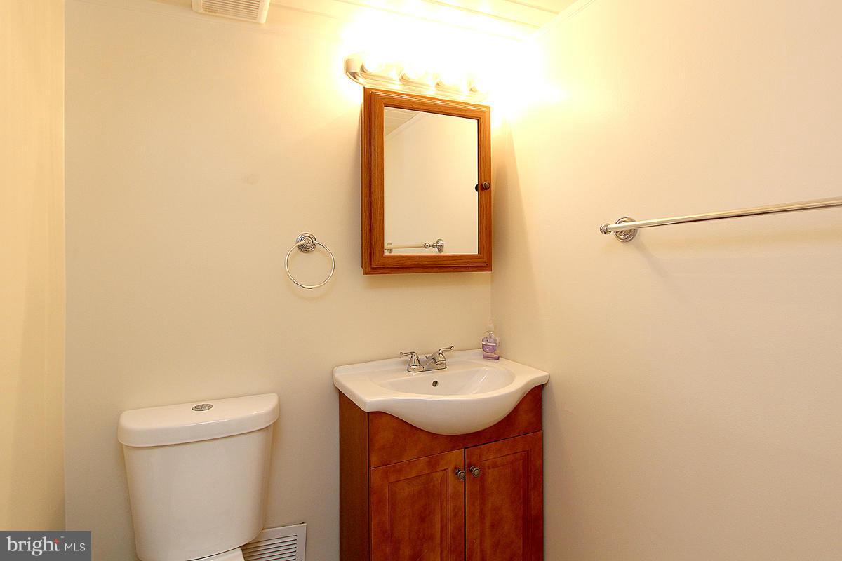 12917 Layhill Road Silver Spring, MD 20906 - Photo 15 of 30 a bathroom with a sink and a toilet