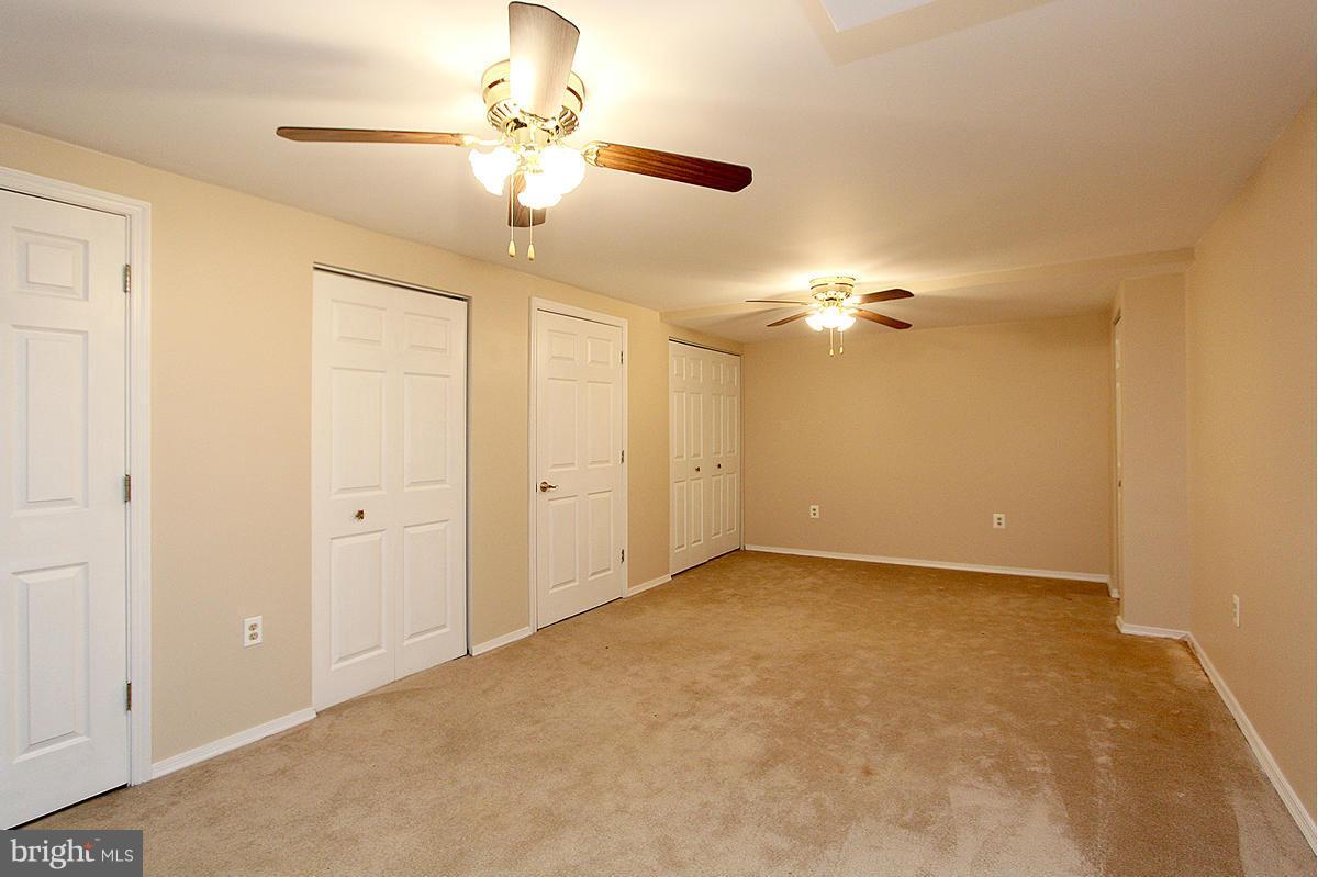 12917 Layhill Road Silver Spring, MD 20906 - Photo 28 of 30 a view of a chandelier fan and entryway