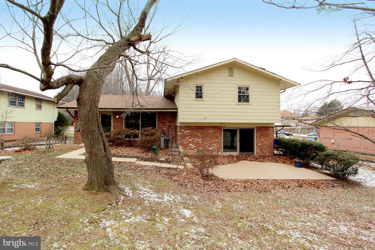 12917 Layhill Road Silver Spring, MD 20906 - Photo 30 of 30 a view of a house with a yard covered in snow