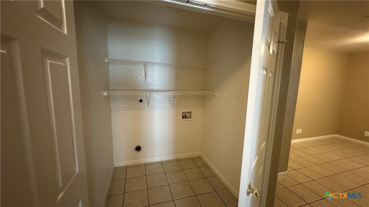 3209 Baldwin Loop, Unit A Killeen, TX 76549 - Photo 6 of 9 a bathroom with a granite countertop shower and a sink