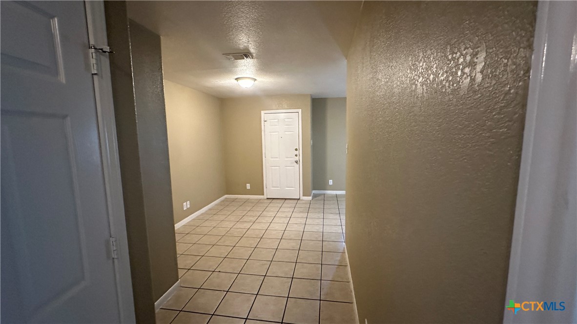 3209 Baldwin Loop, Unit A Killeen, TX 76549 - Photo 7 of 9 a view of an empty room with windows