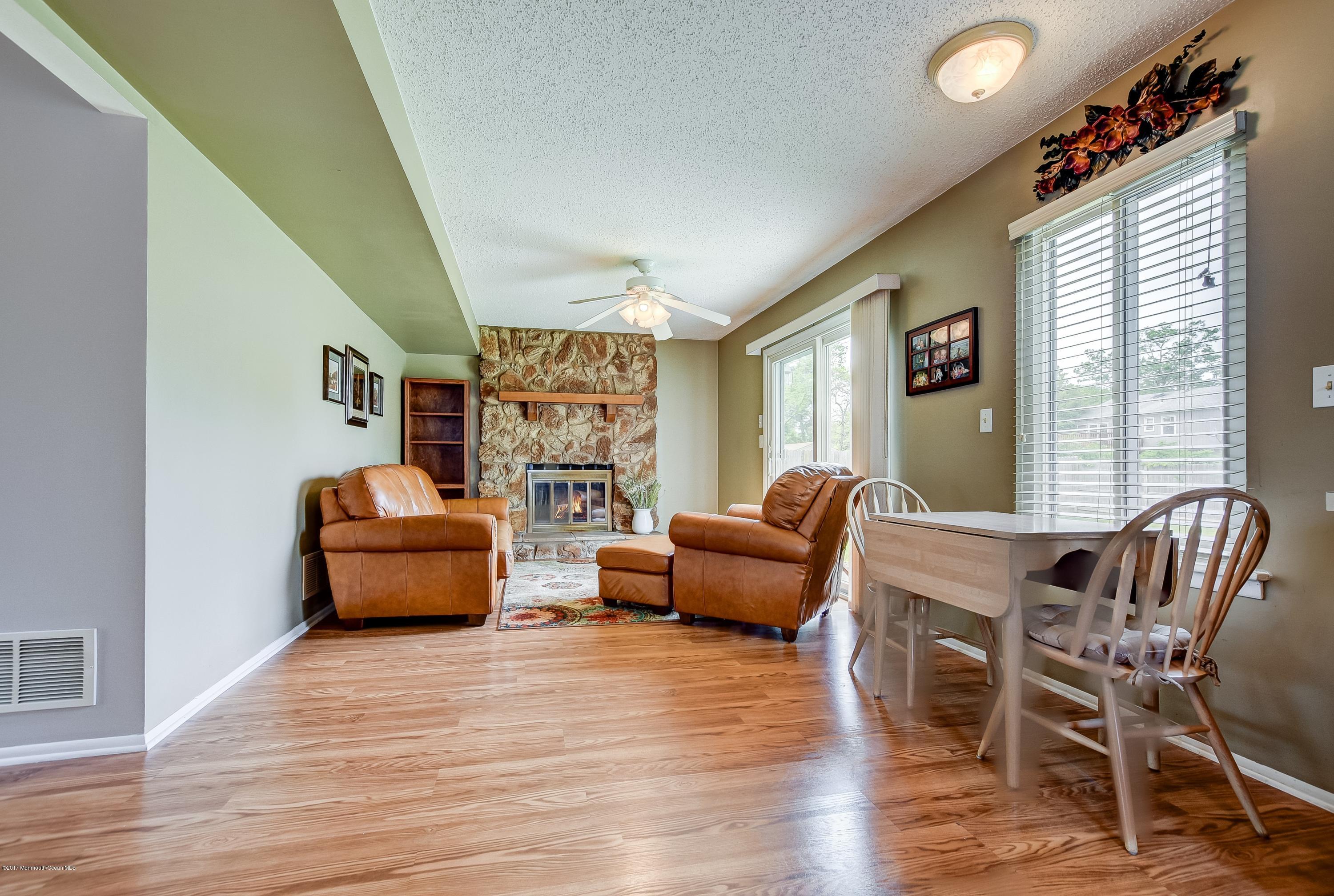 127 Reflection Road Toms River, NJ 08753 - Photo 11 of 20 a living room with furniture and a wooden floor
