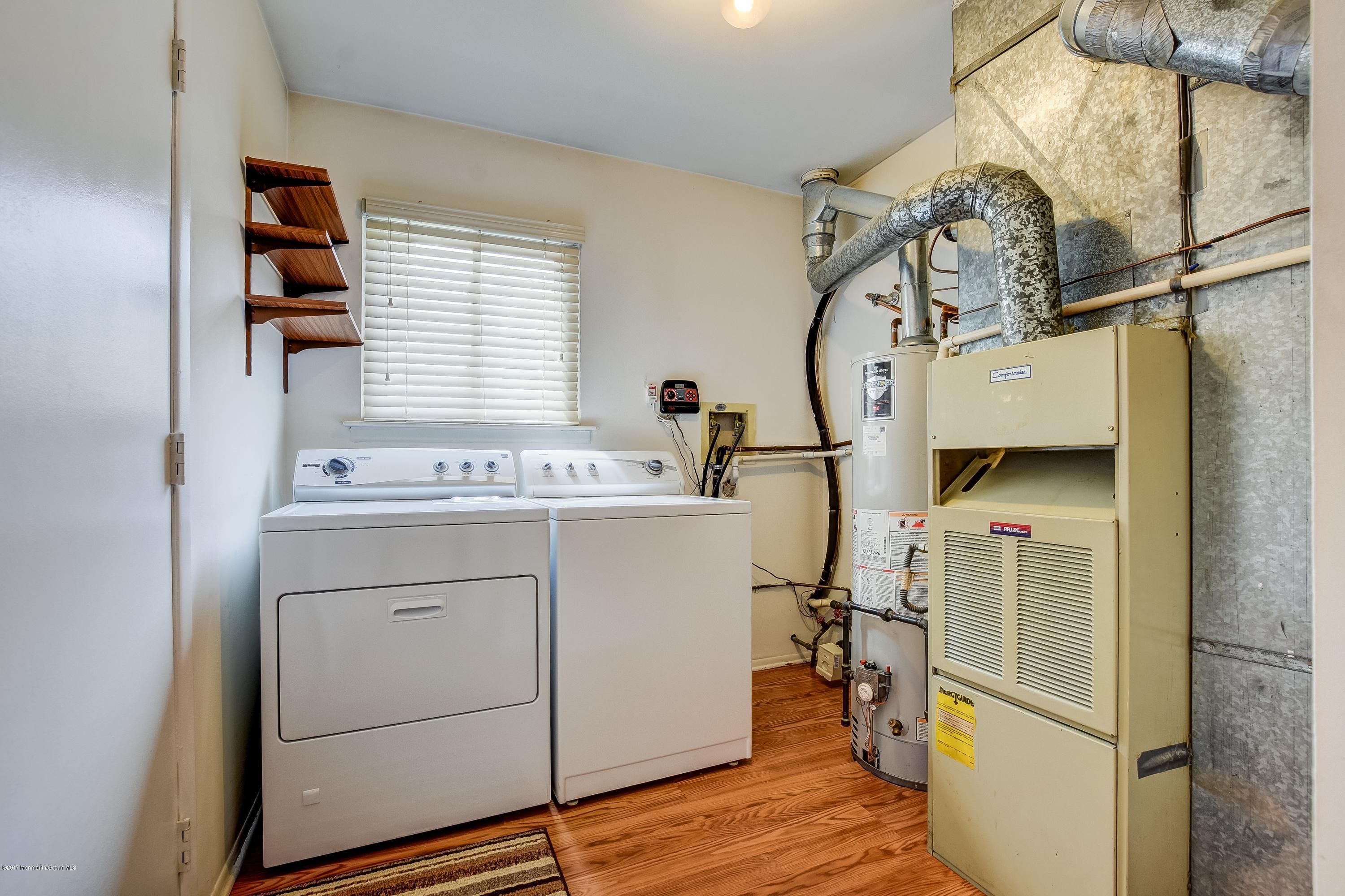 127 Reflection Road Toms River, NJ 08753 - Photo 17 of 20 a room with storage and utility