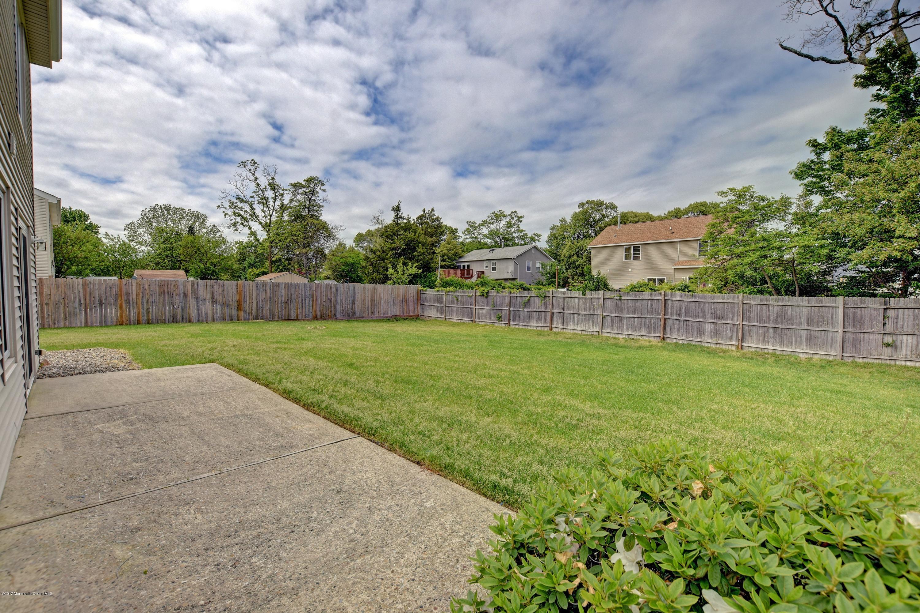 127 Reflection Road Toms River, NJ 08753 - Photo 18 of 20 a view of yard with grass and trees