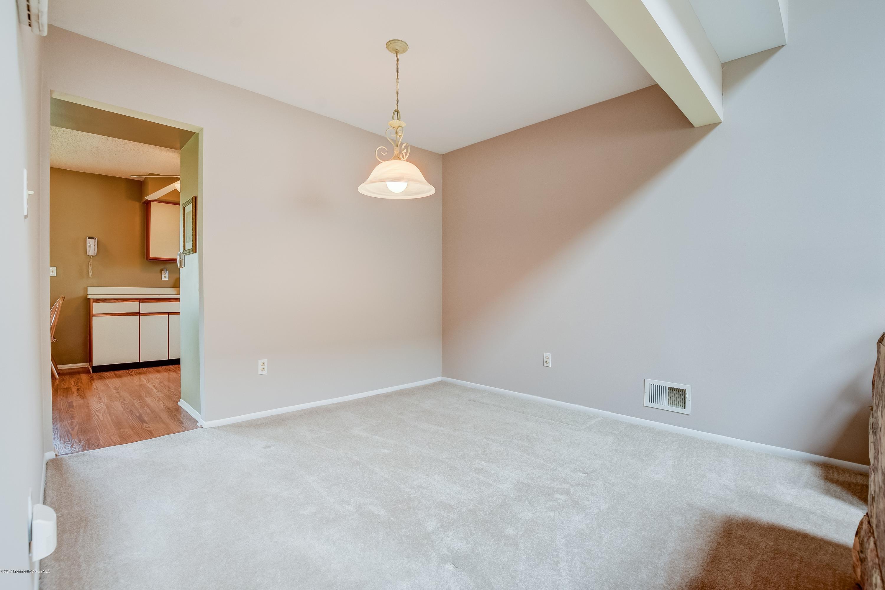 127 Reflection Road Toms River, NJ 08753 - Photo 6 of 20 a view of an empty room and window