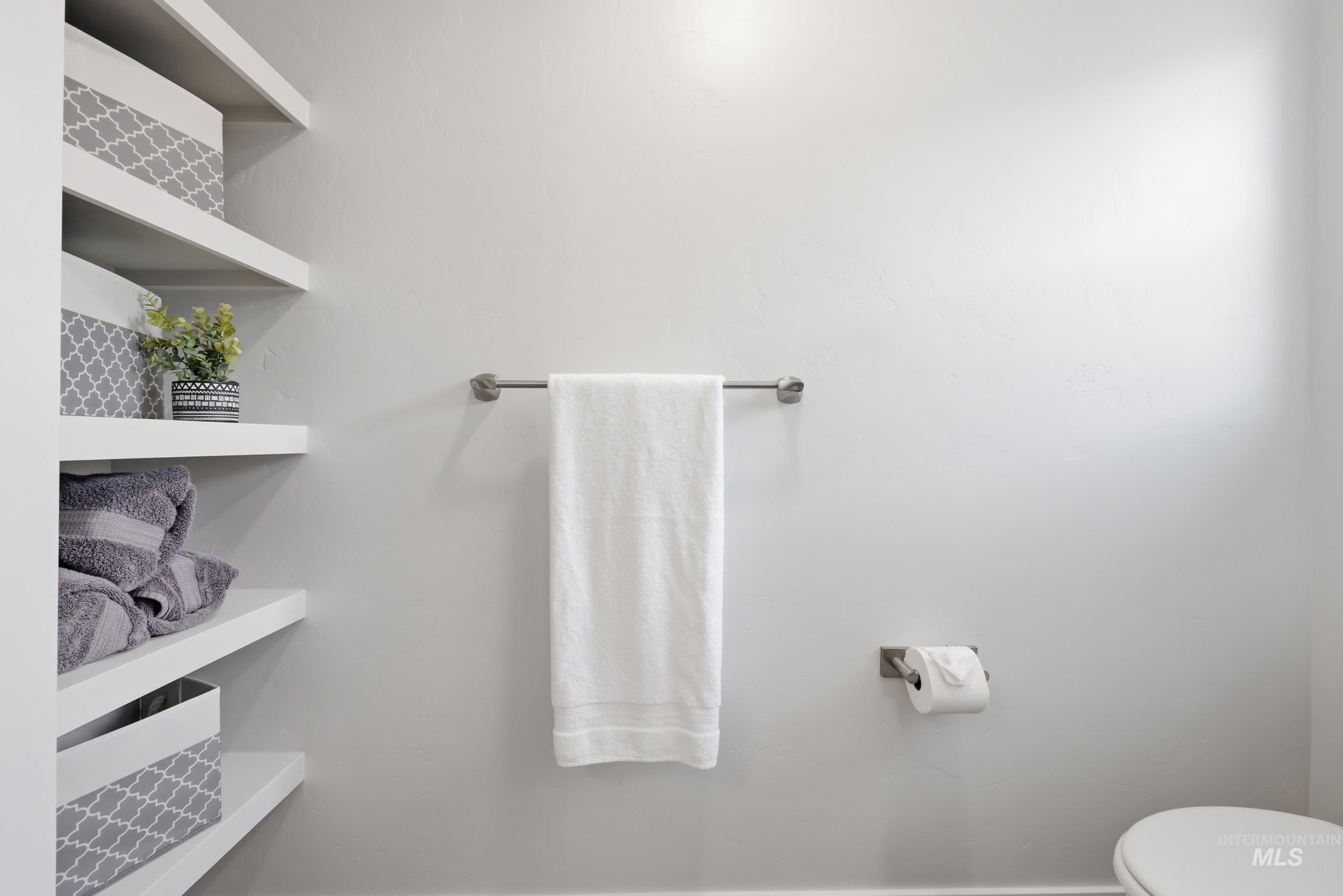3665 W Lane Meridian, ID 83642 - Photo 25 of 42 Recessed shelving with white wood-finish shelves and a light gray wall color