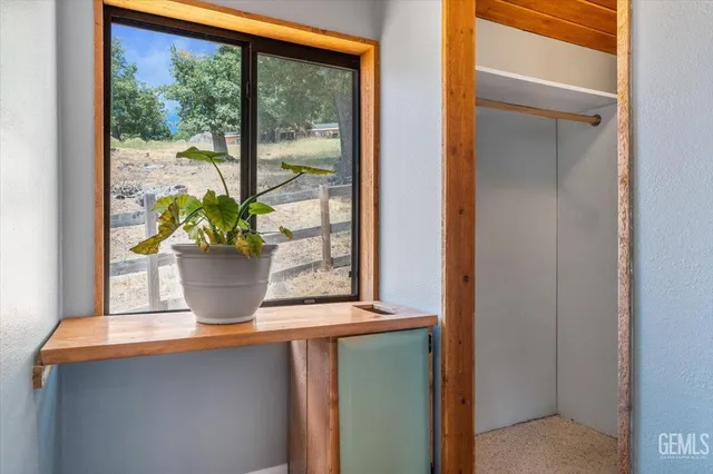 a view of a glass door with a chair