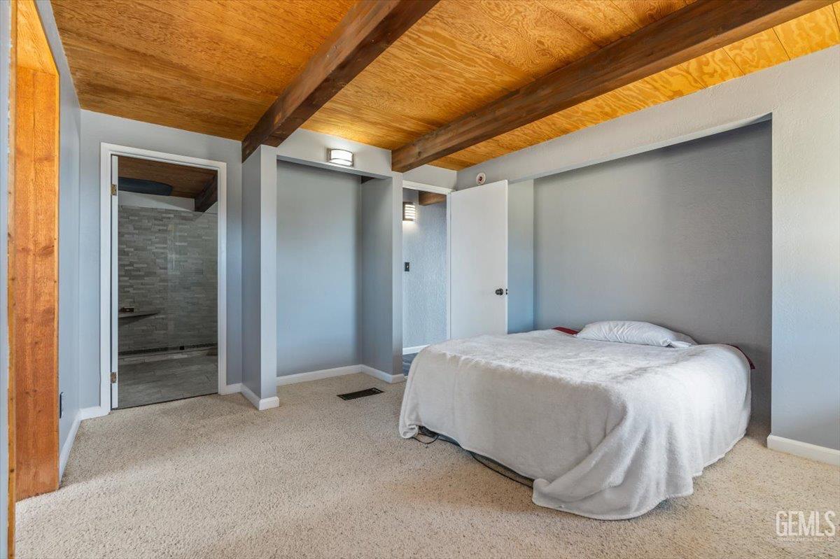 Undisclosed Address Tehachapi, CA 93561 - Photo 15 of 30 a spacious bedroom with a bed and a table