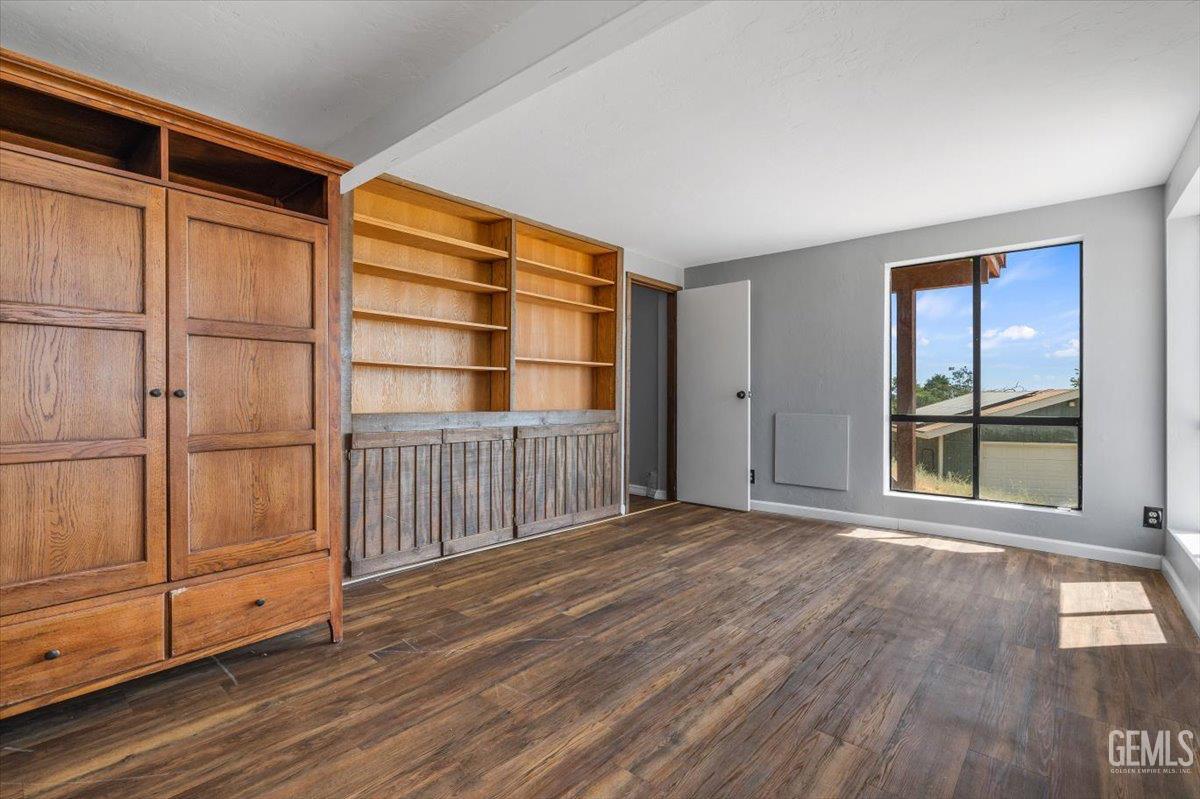 Undisclosed Address Tehachapi, CA 93561 - Photo 21 of 30 a view of an empty room with wooden floor and a window