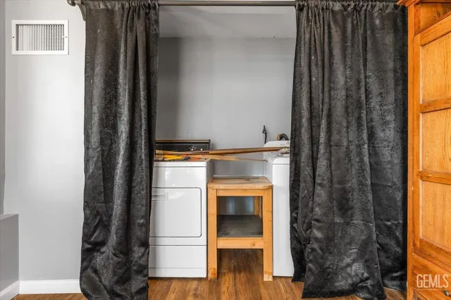a kitchen with a refrigerator and a window