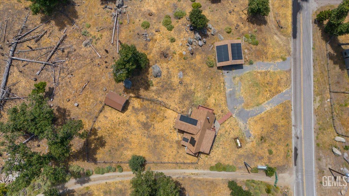 Undisclosed Address Tehachapi, CA 93561 - Photo 25 of 30 a aerial view of a house with a yard