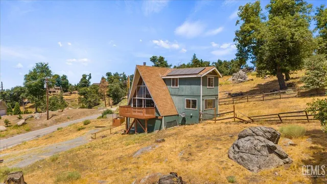 a view of a house with a snow in the background