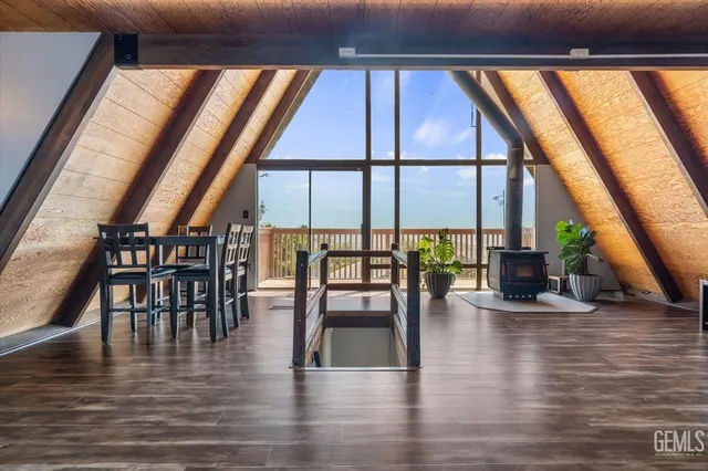 an empty room with furniture and wooden floor
