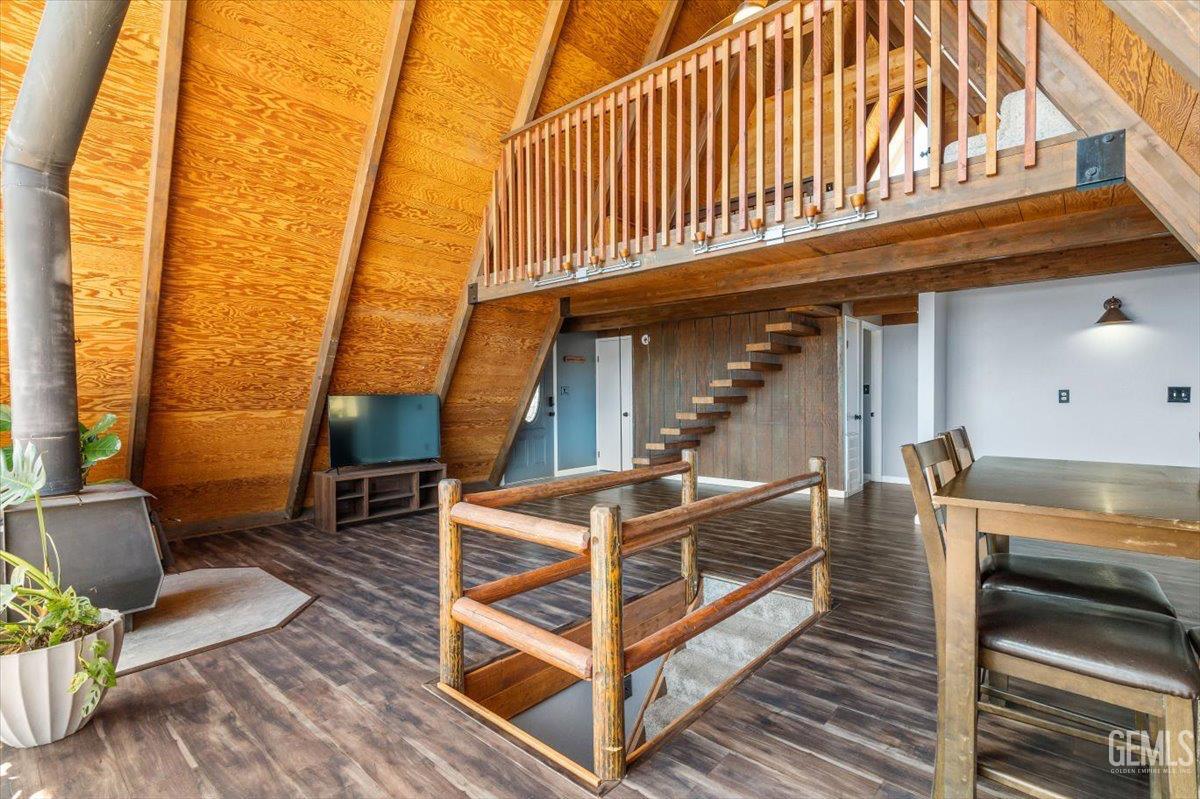 Undisclosed Address Tehachapi, CA 93561 - Photo 8 of 30 a view of a patio with table and chairs with wooden floor and fence