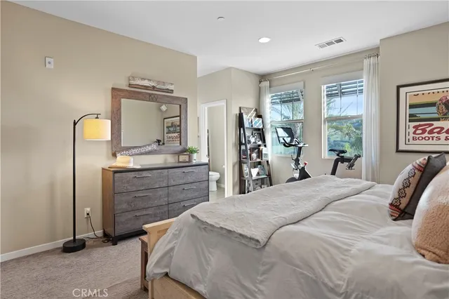 a bedroom with a bed and a cabinets