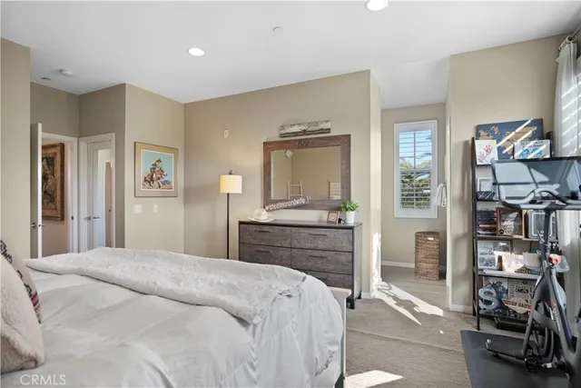 a bathroom with a granite countertop sink a mirror and a shower