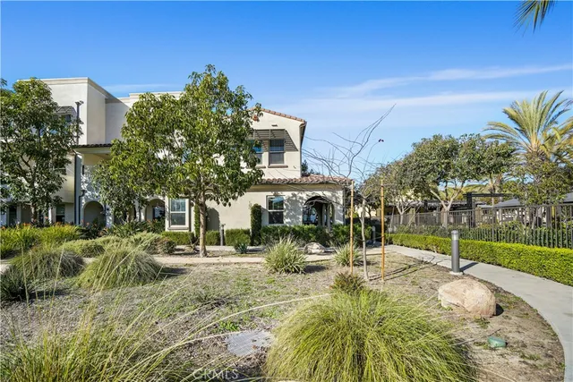 an aerial view of a residential apartment building with a yard