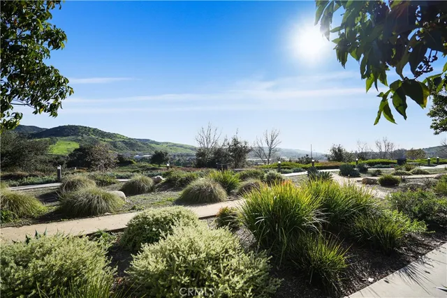 a kitchen with counter top space and living room view