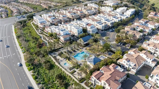 an aerial view of a house with a big yard