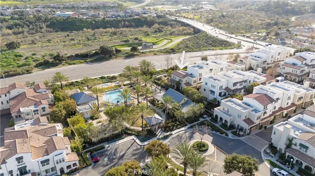 an aerial view of residential houses with yard
