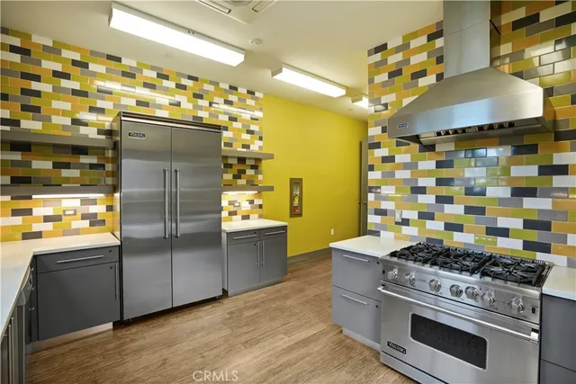 a living room with fireplace furniture and a large window