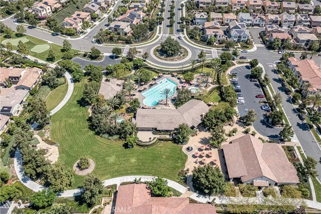 an aerial view of a swimming pool and outdoor space