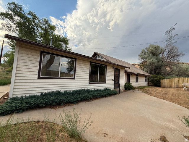 4709 East Independence Road Myton, UT 84052 - Photo 2 of 25 Single-story residence featuring light-colored siding and a brown roof