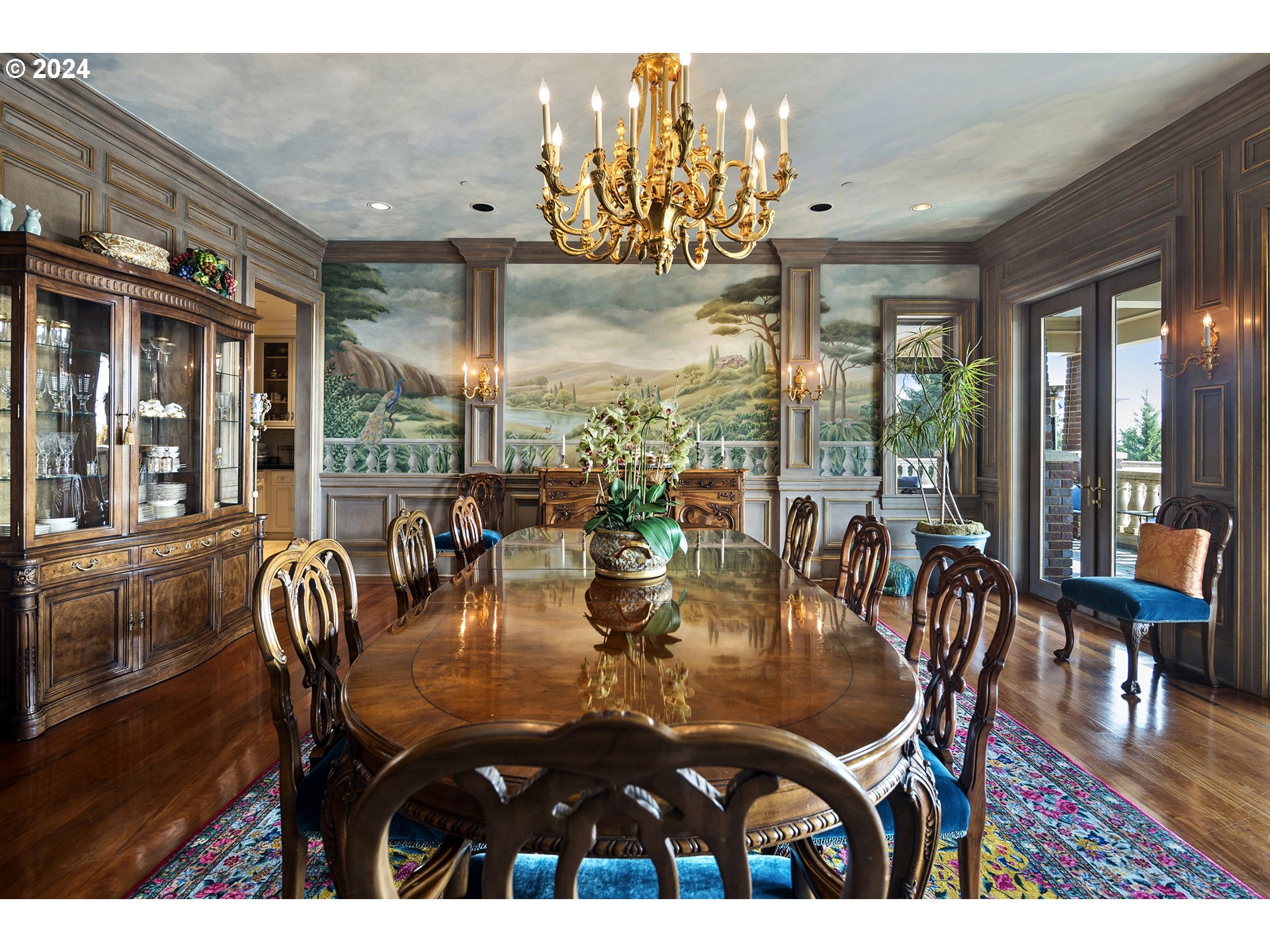11223 Northwest Saltzman Road Portland, OR 97229 - Photo 18 of 46 a view of a dining room with furniture a chandelier and wooden floor