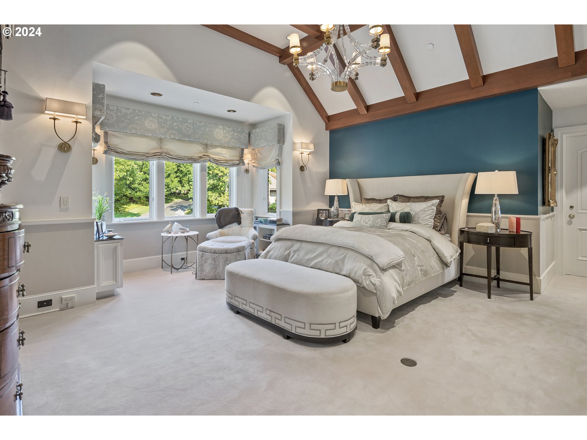 11223 Northwest Saltzman Road Portland, OR 97229 - Photo 28 of 46 a bedroom with a large bed and a large window