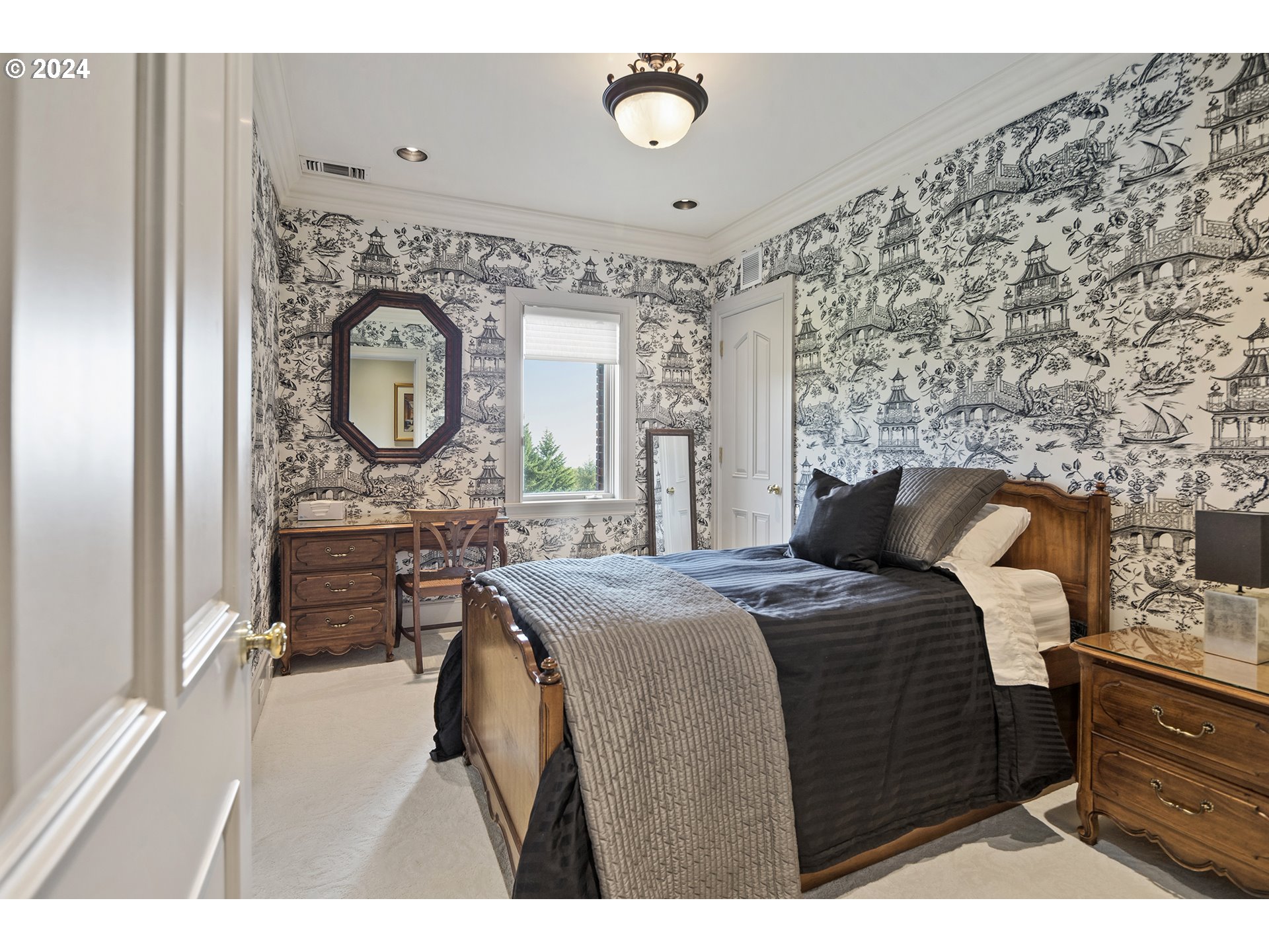 11223 Northwest Saltzman Road Portland, OR 97229 - Photo 35 of 46 a bedroom with a bed dresser and a window