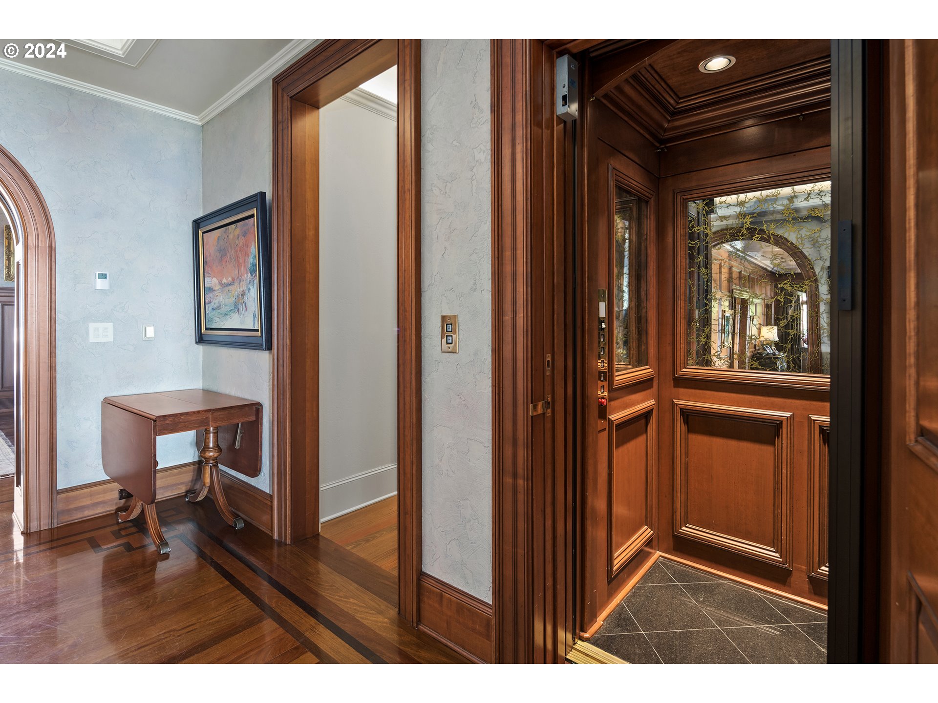 11223 Northwest Saltzman Road Portland, OR 97229 - Photo 38 of 46 a view of a hallway with wooden floor and furniture