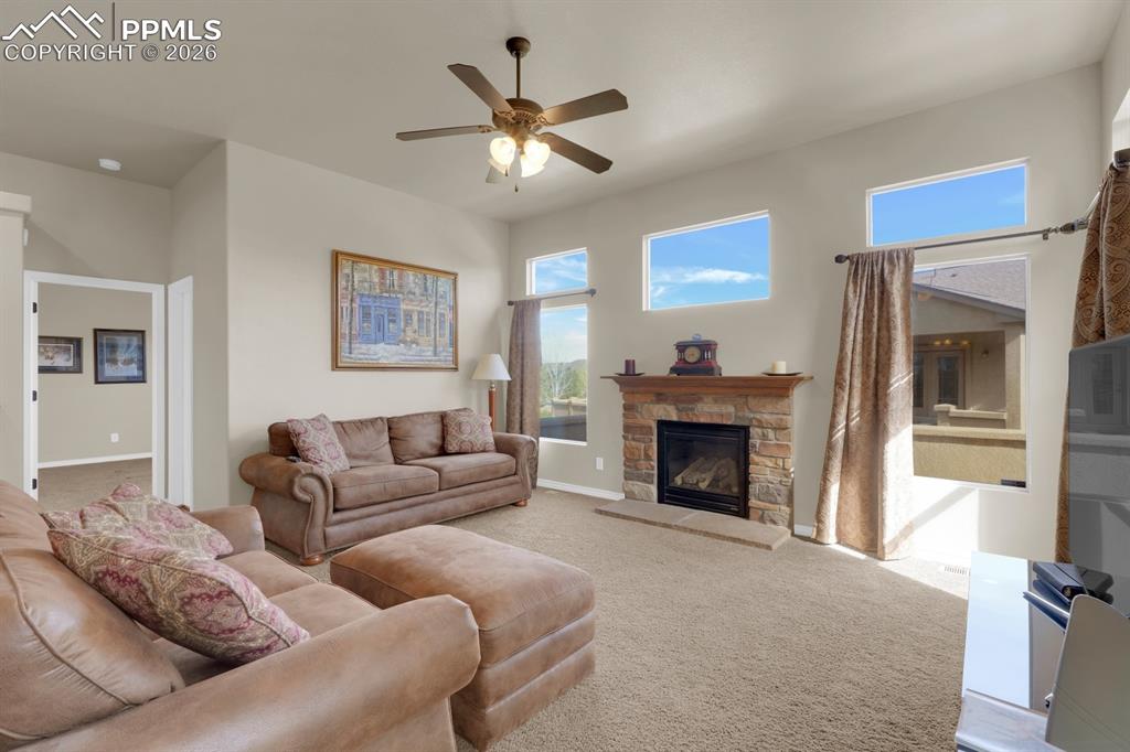 7636 Wichita Ridge Point Colorado Springs, CO 80923 - Photo 3 of 33 Living Room walks out to patio