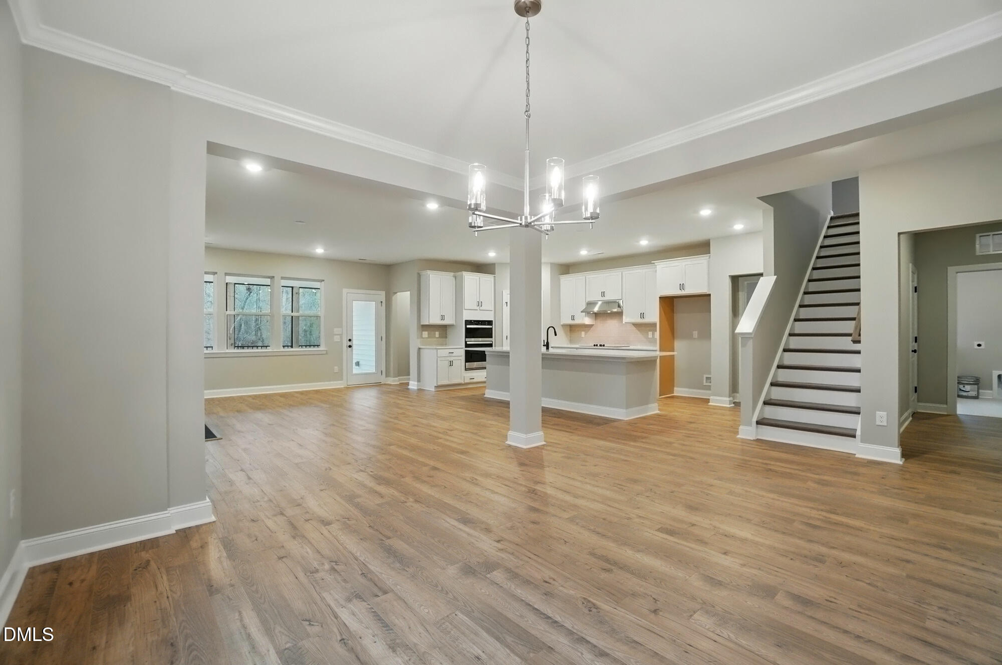 285 Gilliland Road Siler City, NC 27344 - Photo 7 of 45 a view of a room with wooden floor and kitchen