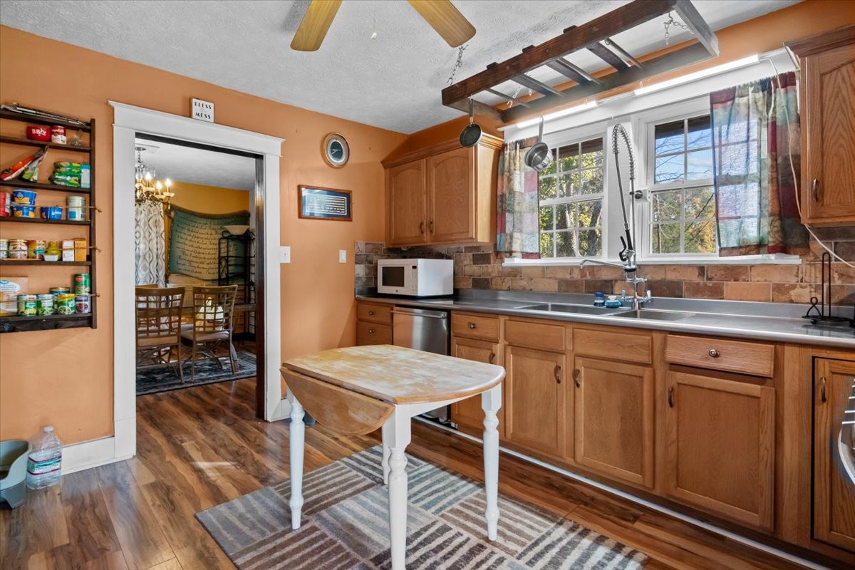 676 Mt Lebanon Road Dickson, TN 37055 - Photo 11 of 74 a kitchen with granite countertop a sink and wooden cabinets
