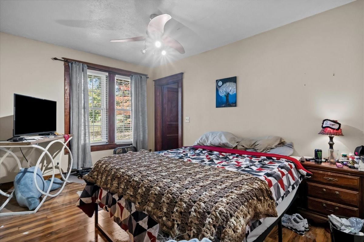 676 Mt Lebanon Road Dickson, TN 37055 - Photo 18 of 74 a bedroom with a bed and a flat screen tv