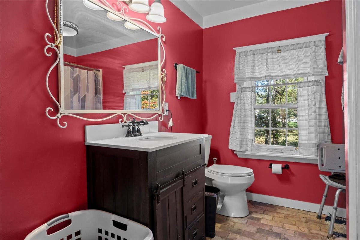 676 Mt Lebanon Road Dickson, TN 37055 - Photo 19 of 74 a bathroom with a sink toilet and mirror