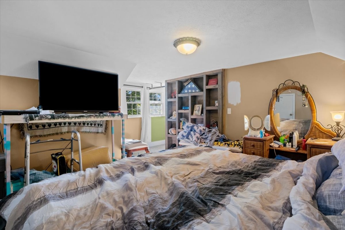 676 Mt Lebanon Road Dickson, TN 37055 - Photo 21 of 74 a bedroom with a bed and a flat screen tv