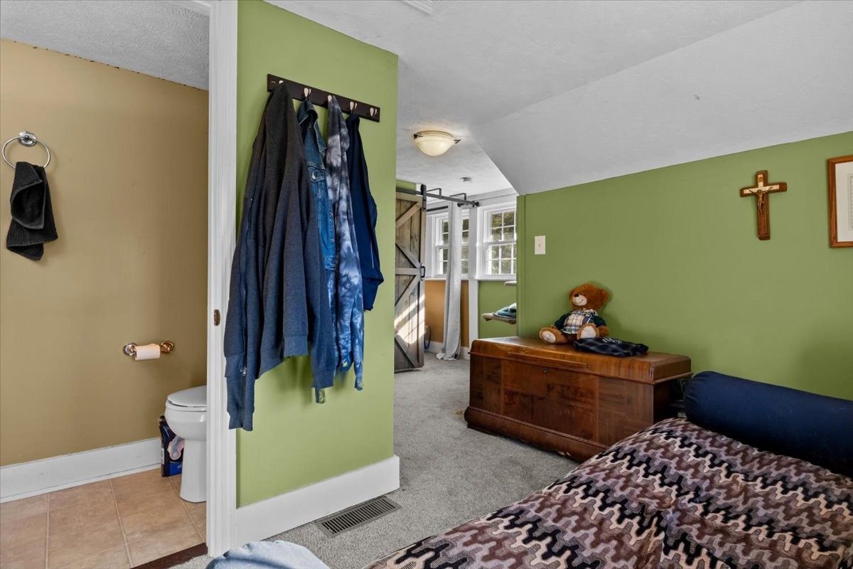 676 Mt Lebanon Road Dickson, TN 37055 - Photo 25 of 74 a bedroom with two beds and painted walls
