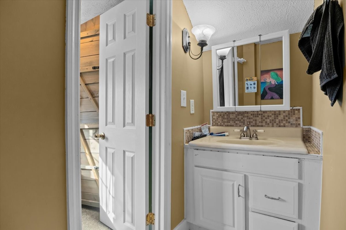 676 Mt Lebanon Road Dickson, TN 37055 - Photo 27 of 74 a bathroom with a sink a mirror a vanity and a shower