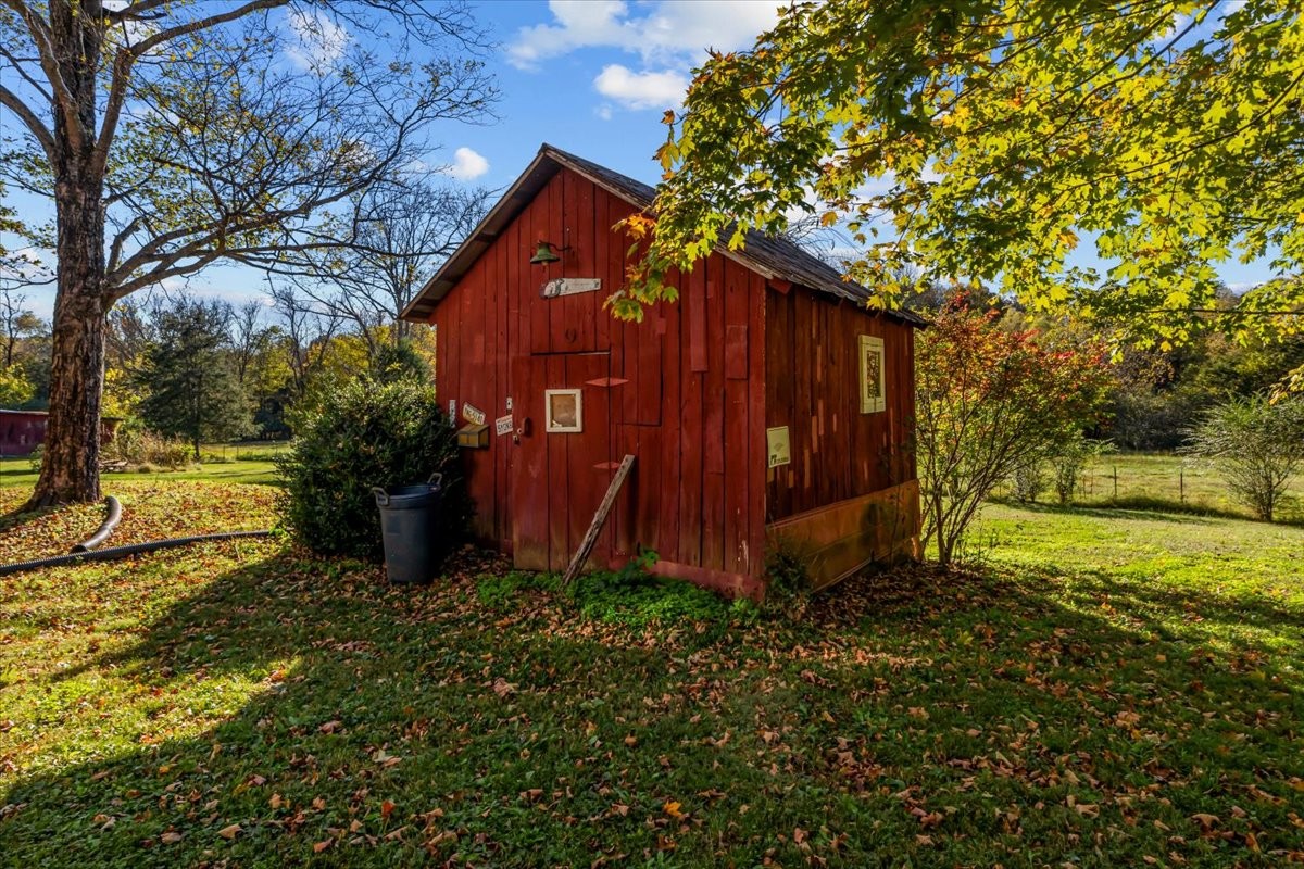 676 Mt Lebanon Road Dickson, TN 37055 - Photo 35 of 74 a view of a backyard with potted plants and large trees