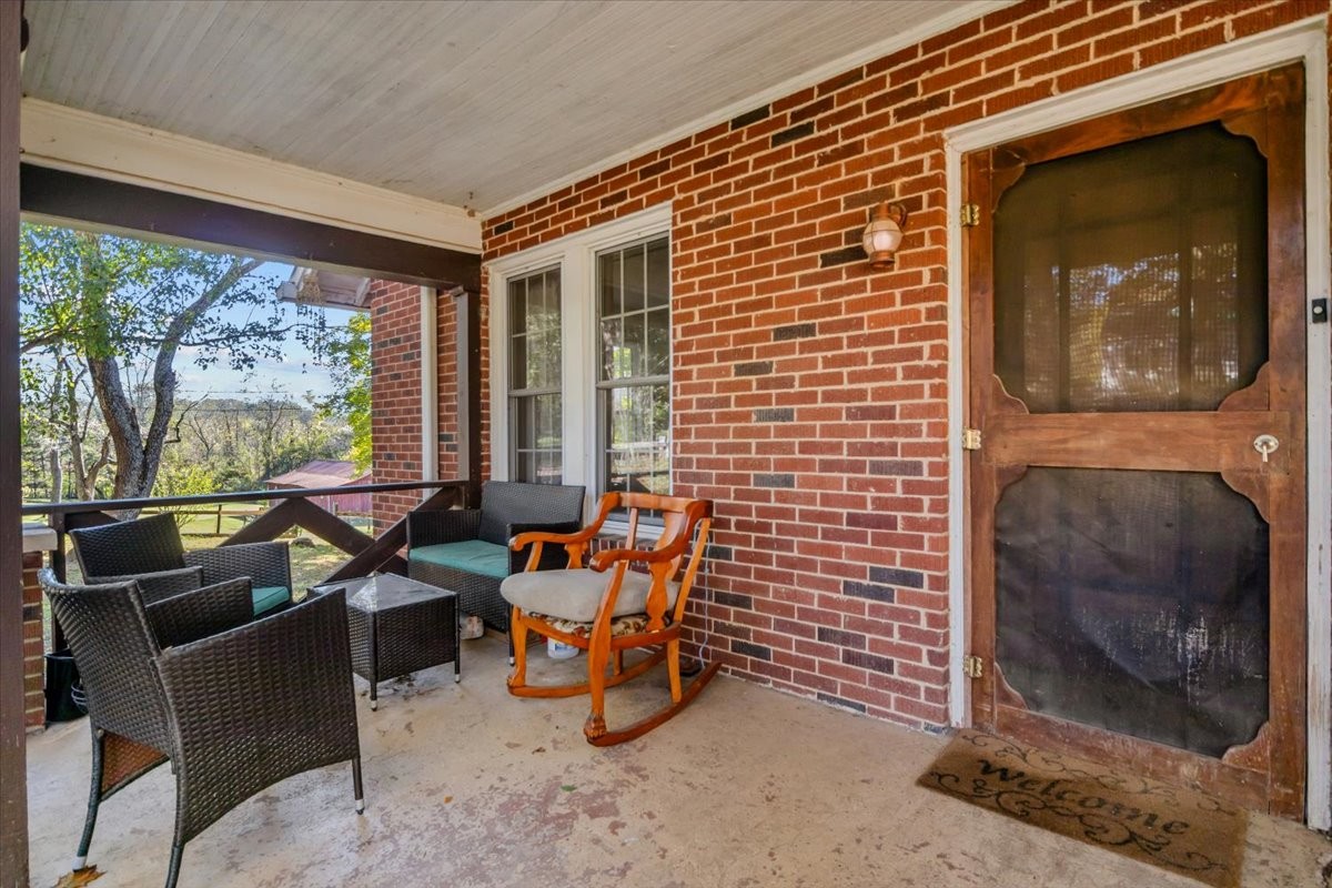 676 Mt Lebanon Road Dickson, TN 37055 - Photo 5 of 74 a living room with furniture and a floor to ceiling window