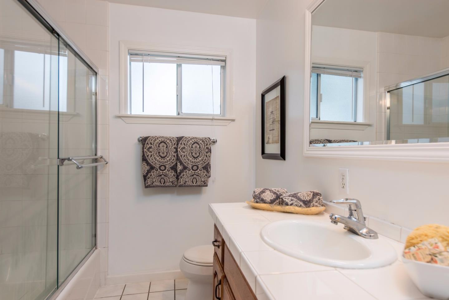 1003 Mango Avenue Sunnyvale, CA 94087 - Photo 14 of 23 a bathroom with a sink toilet and shower