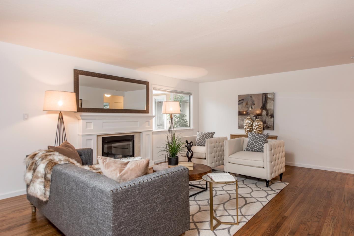 1003 Mango Avenue Sunnyvale, CA 94087 - Photo 3 of 23 a living room with furniture and a fireplace