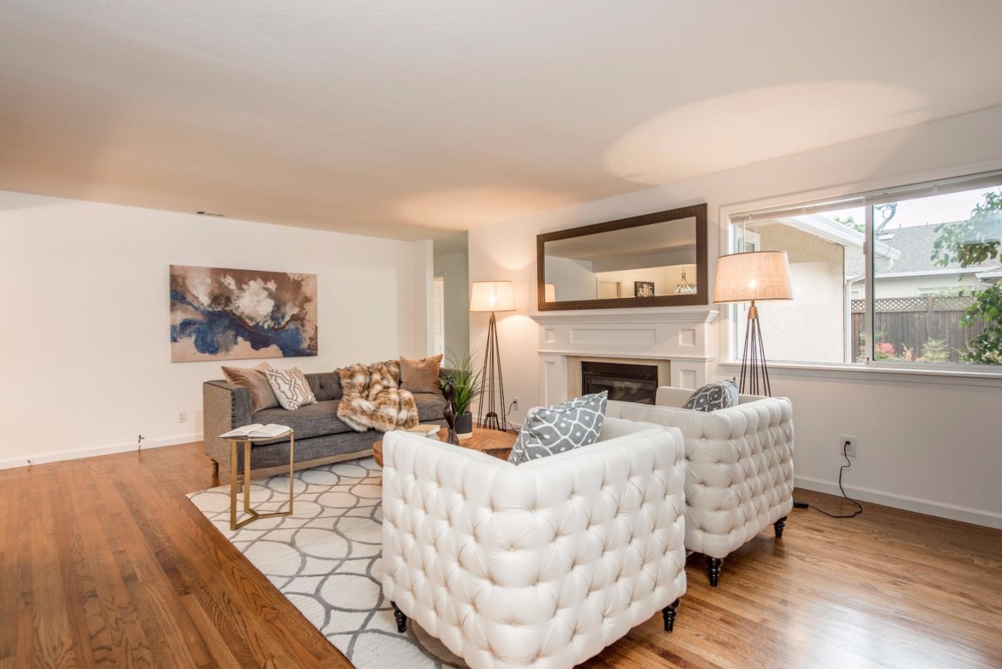 1003 Mango Avenue Sunnyvale, CA 94087 - Photo 4 of 23 a living room with furniture and a fireplace