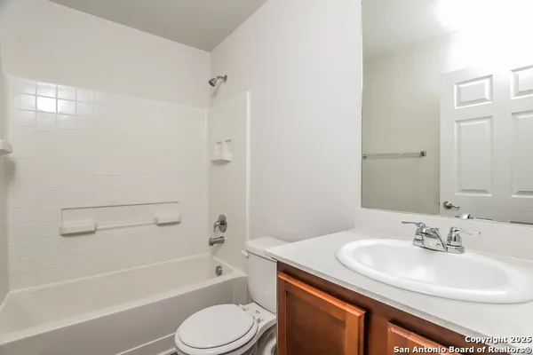 a bathroom with a sink toilet tub and shower